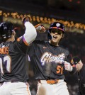 May 13, 2025; San Francisco, California, USA; San Francisco Giants center fielder Jung Hoo Lee (51) is congratulated by left fielder Heliot Ramos (17) after he hit a three-run home run against the Arizona Diamondbacks during the eighth inning at Oracle Park. Mandatory Credit: John Hefti-Imagn Images