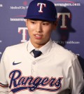 May 18, 2025; Arlington, Texas, USA; Seong-Jun Kim of the Texas Rangers talks to the media after signing with the team before the game against the Houston Astros at Globe Life Field. Mandatory Credit: Tim Heitman-Imagn Images