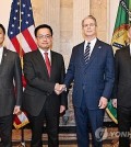 South Korea's Finance Minister Choi Sang-mok (2nd from L), Trade Minister Ahn Duk-geun (L), U.S. Treasury Secretary Scott Bessent (2nd from R) and U.S. Trade Representative (USTR) Jamieson Greer pose for a photo prior to trade talks in Washington on April 24, 2025, in this photo provided by Seoul's industry ministry. (PHOTO NOT FOR SALE) (Yonhap)