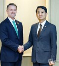 This photo provided by South Korea's Ministry of Trade, Industry and Energy shows Industry Minister Ahn Duk-geun (R) shaking hands with U.S. Trade Representative Jamieson Greer in their meeting held on the sidelines of the Asia-Pacific Economic Cooperation trade ministers' meeting on the southern Jeju Island on May 16, 2025. (PHOTO NOT FOR SALE) (Yonhap)