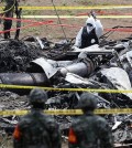 Authorities conduct an on-site probe in the southeastern city of Pohang on May 30, 2025, following a fatal crash of a naval patrol aircraft carrying four officers. (Yonhap)