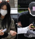 Two people arrive at the Seoul Central District Court in southern Seoul for an arrest warrant hearing on May 17, 2025. (Yonhap)