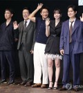 The director and cast of Disney+'s new Korean original series "Nine Puzzles" pose for a photo during a press conference at a Seoul hotel on May 14, 2025. (Yonhap)