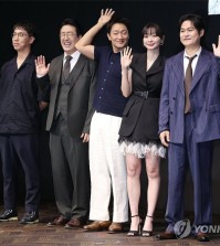 The director and cast of Disney+'s new Korean original series "Nine Puzzles" pose for a photo during a press conference at a Seoul hotel on May 14, 2025. (Yonhap)