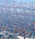 Containers await shipment at a port in the southeastern city of Busan, in this April 30, 2025, file photo. (Yonhap)