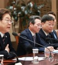 President Lee Jae-myung (L) speaks during the second meeting of the emergency economic task force held at the presidential office in Seoul on June 9, 2025. (Pool photo) (Yonhap)